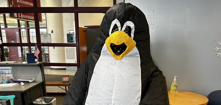 office with person in Penguin custome